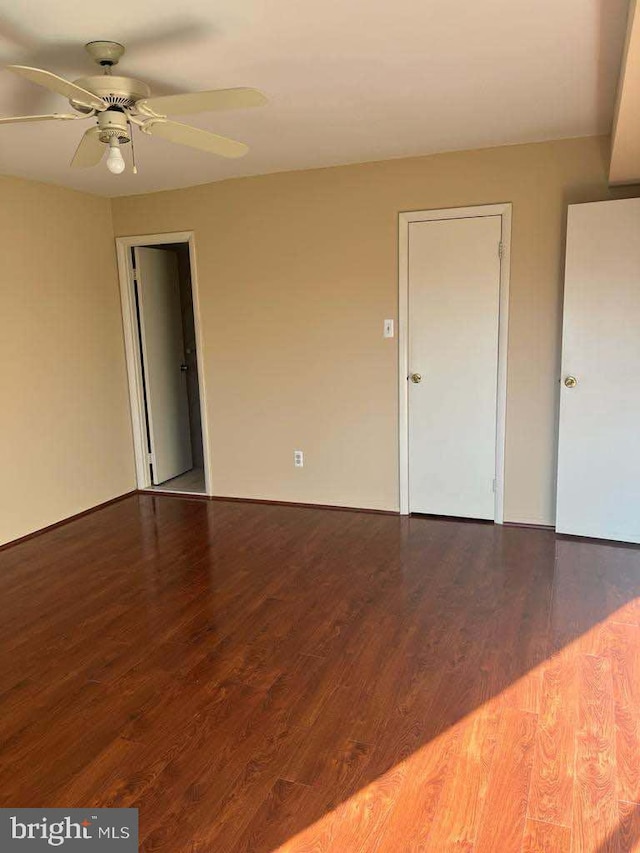 unfurnished room featuring hardwood / wood-style flooring and ceiling fan