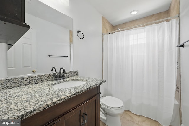 full bath featuring tile patterned floors, shower / tub combo with curtain, vanity, and toilet