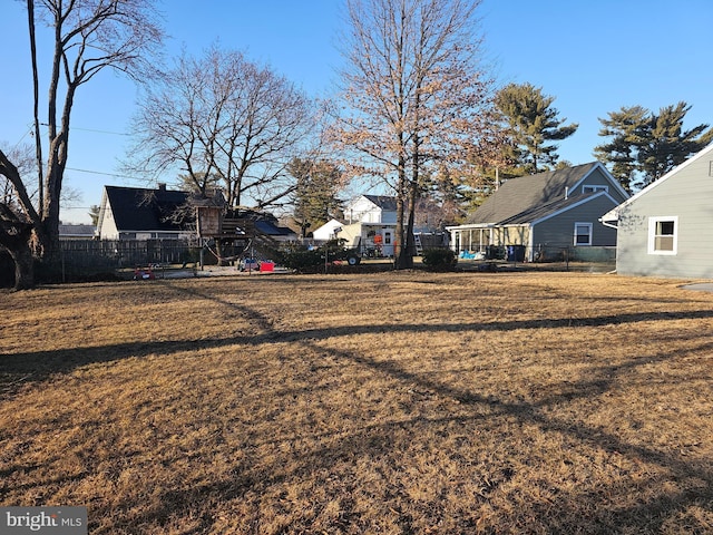 view of yard with a residential view and fence