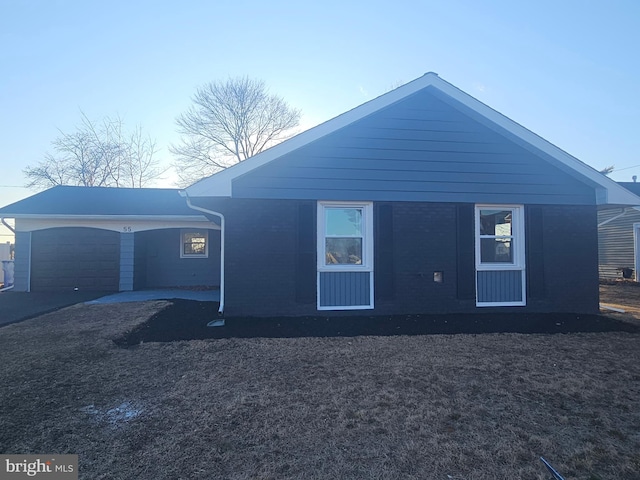 exterior space featuring brick siding