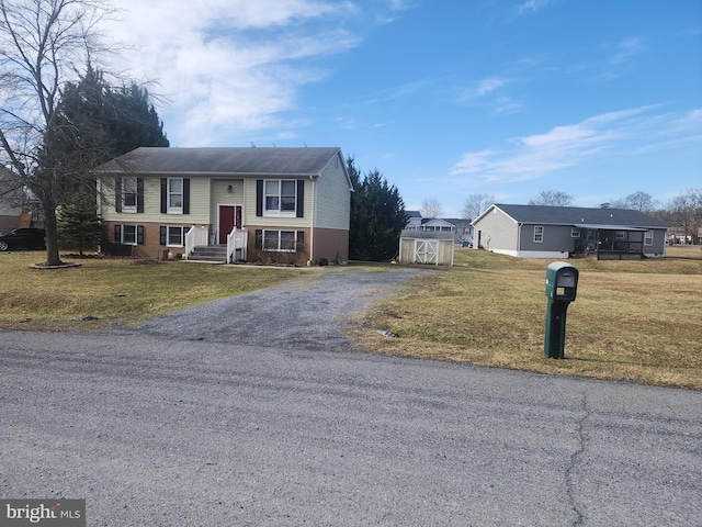 raised ranch featuring a front lawn