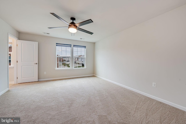 carpeted empty room with ceiling fan