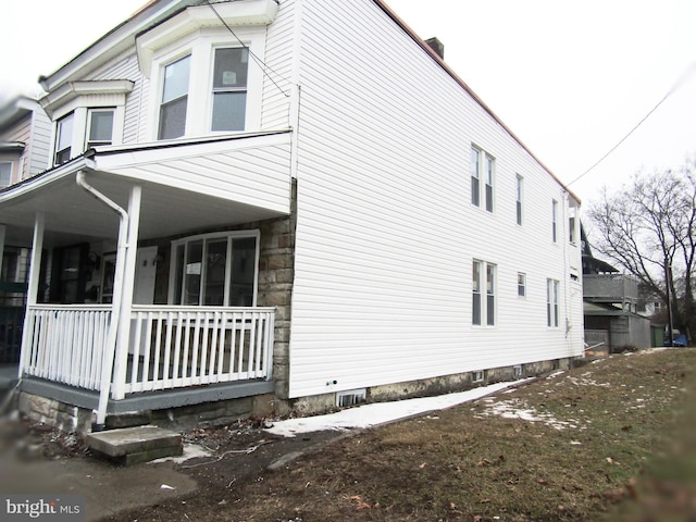 view of home's exterior featuring covered porch