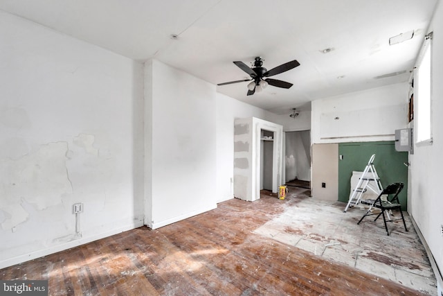 unfurnished room with hardwood / wood-style flooring and ceiling fan