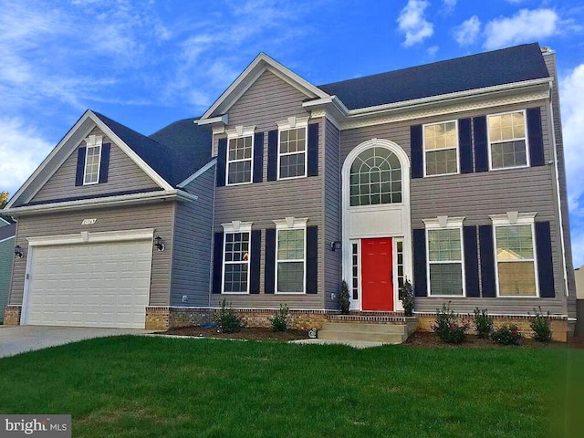 view of front facade with an attached garage, a front lawn, and concrete driveway