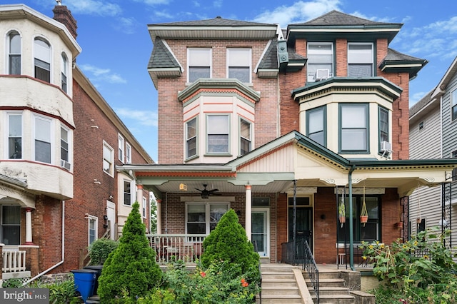 view of front facade featuring a porch and brick siding