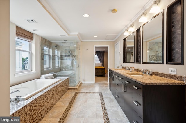 bathroom with a stall shower, baseboards, visible vents, a garden tub, and crown molding