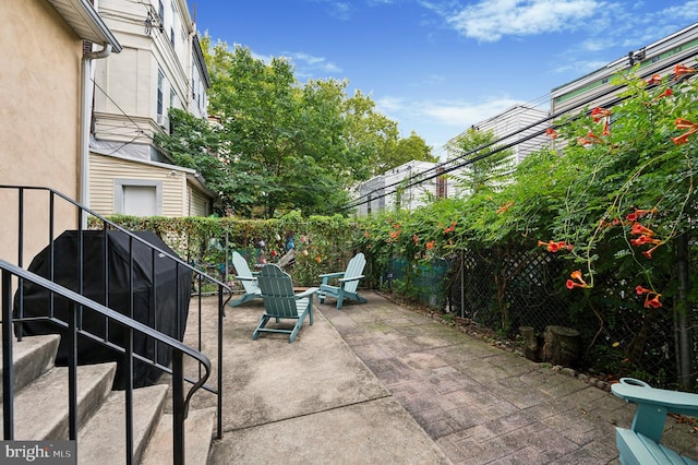 view of patio / terrace with fence