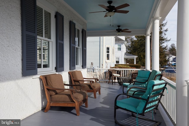 deck featuring a porch and a ceiling fan