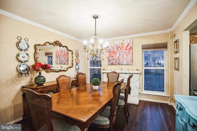 dining area featuring dark wood-type flooring, crown molding, and a chandelier