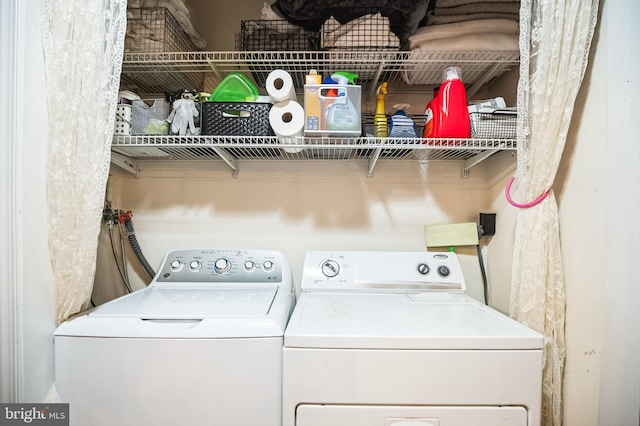 laundry room featuring washing machine and dryer