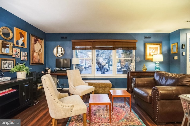 sitting room featuring dark hardwood / wood-style floors