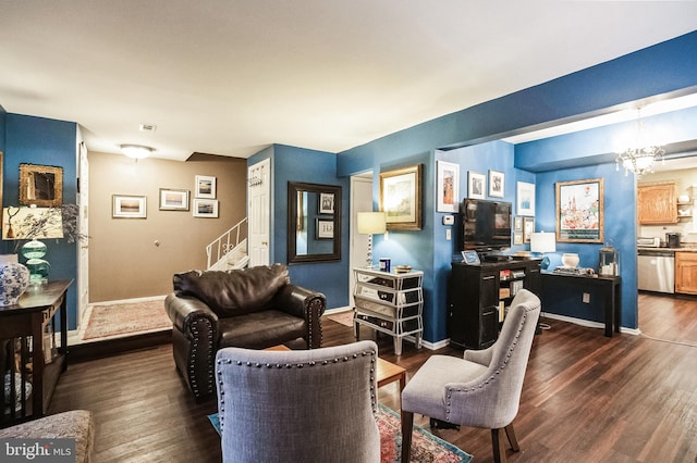 living room featuring a chandelier and dark hardwood / wood-style floors