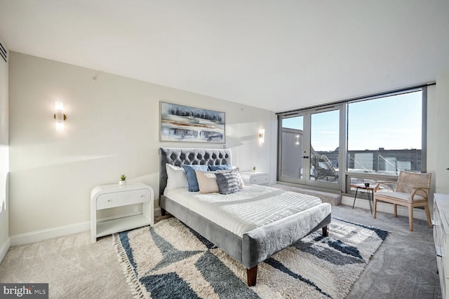 bedroom featuring light carpet and baseboards