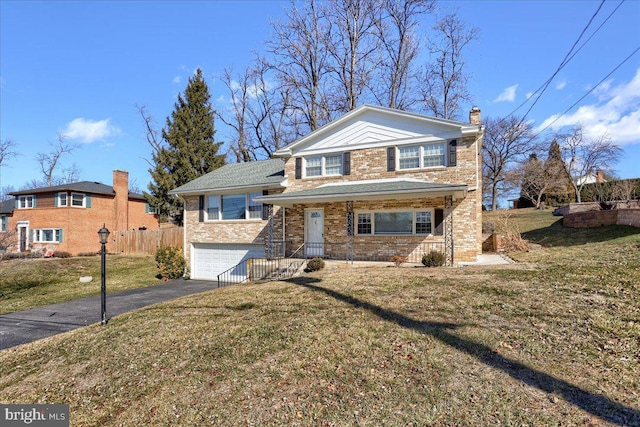 view of front facade with a front lawn and a garage