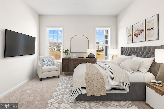 carpeted bedroom featuring multiple windows