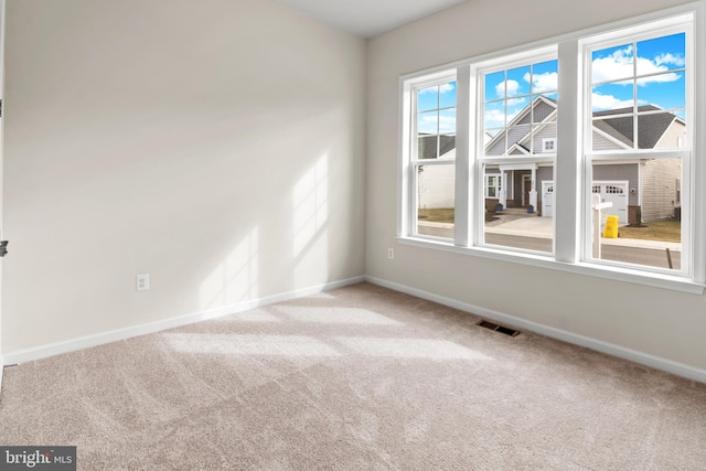 spare room featuring carpet flooring