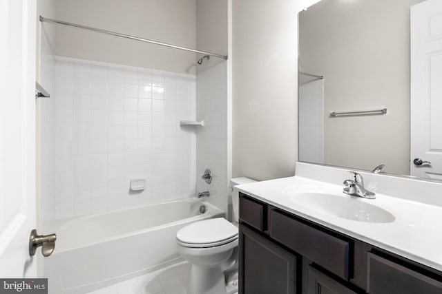 full bathroom featuring toilet, vanity, tile patterned flooring, and tiled shower / bath combo