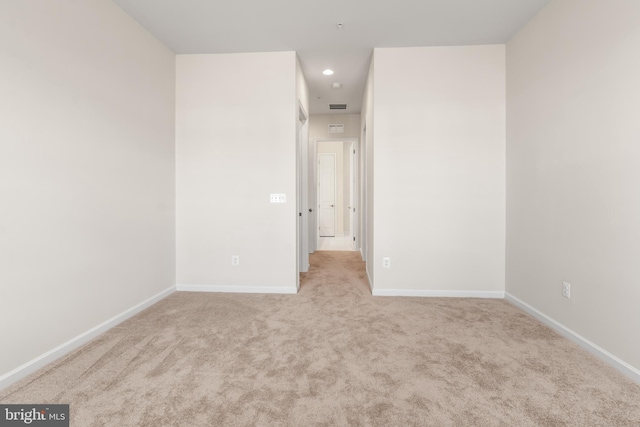 unfurnished bedroom featuring light carpet