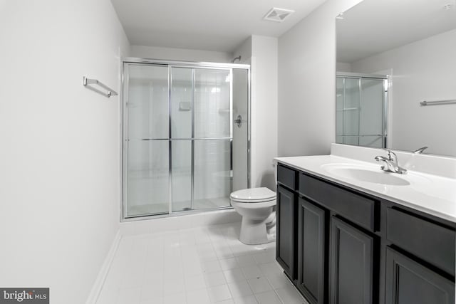 bathroom featuring toilet, vanity, and walk in shower