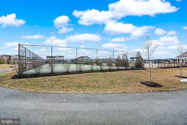 exterior space featuring a yard and tennis court