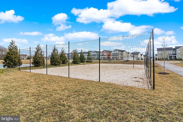 surrounding community featuring a yard and volleyball court