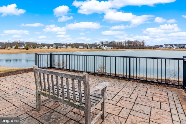 view of patio with a water view