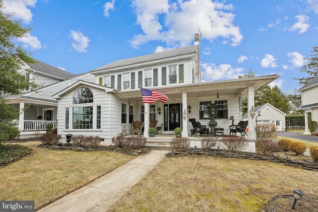 view of front of house featuring covered porch, crawl space, a front lawn, and a chimney