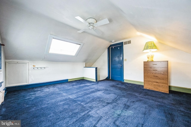 additional living space featuring carpet, visible vents, vaulted ceiling, and a ceiling fan