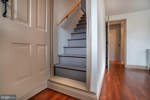 stairway featuring hardwood / wood-style flooring