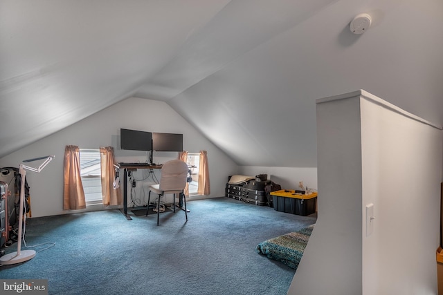 carpeted bedroom with lofted ceiling