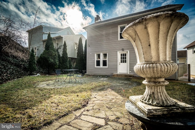 rear view of house featuring a patio