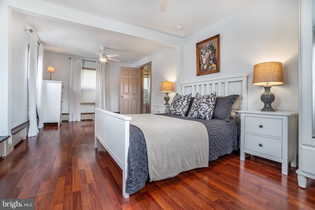 bedroom featuring dark hardwood / wood-style flooring and ceiling fan