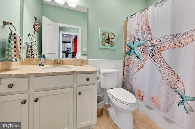 full bathroom featuring tile patterned flooring, vanity, toilet, and shower / bath combo