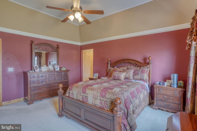 carpeted bedroom with ornamental molding, vaulted ceiling, and ceiling fan