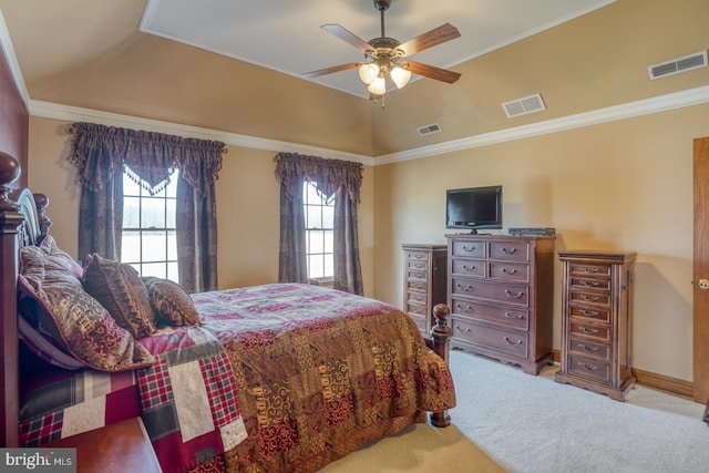 carpeted bedroom with ceiling fan, ornamental molding, and vaulted ceiling