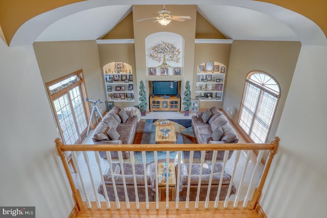 living room featuring high vaulted ceiling and ceiling fan