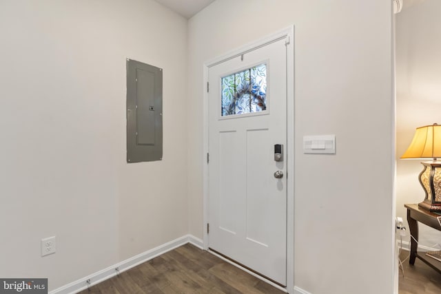 entrance foyer with dark wood-type flooring, electric panel, and baseboards