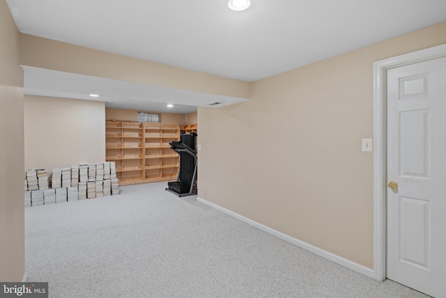 finished below grade area featuring carpet, baseboards, and recessed lighting