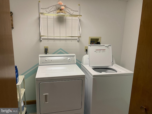 clothes washing area featuring laundry area and washer and dryer