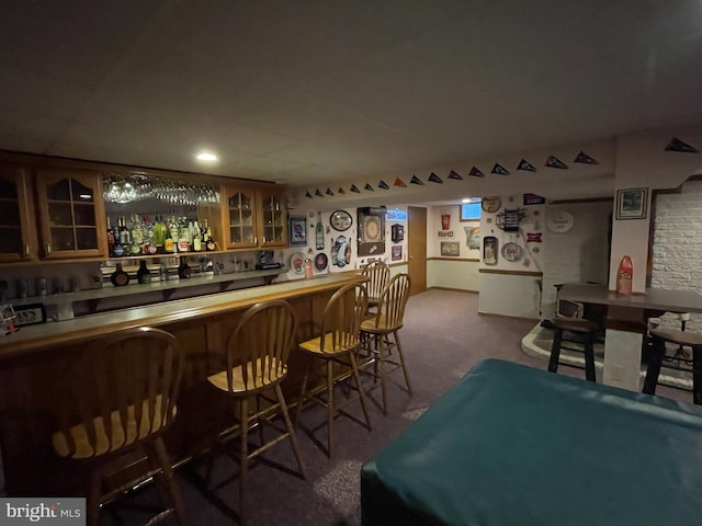 bar with a dry bar and carpet floors