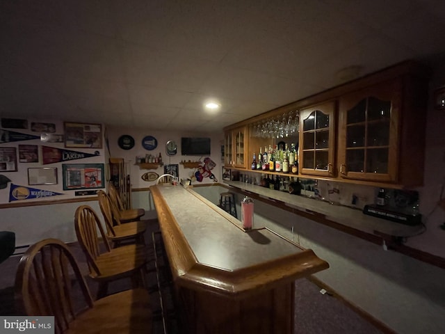 bar featuring a dry bar and a paneled ceiling