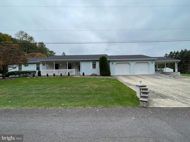 single story home with an attached garage, covered porch, concrete driveway, and a front yard