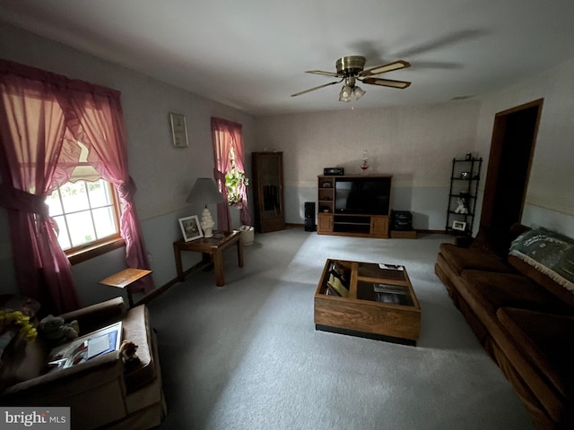 living room with ceiling fan and visible vents