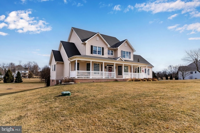 view of front of property with a porch and a front lawn