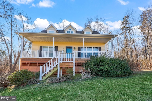 view of front of house with covered porch and a front yard