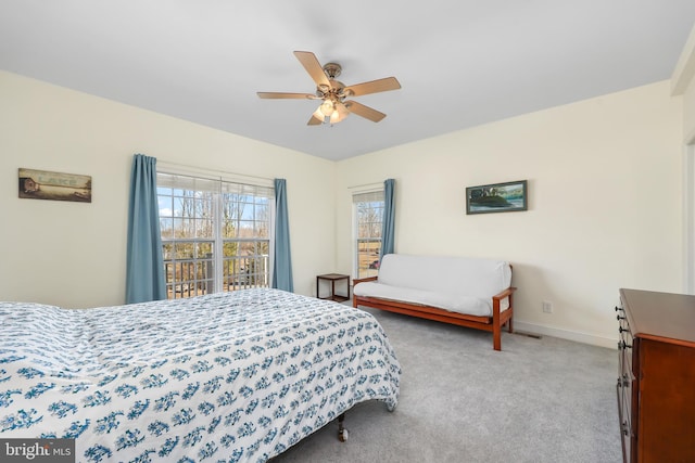 bedroom with ceiling fan and light colored carpet