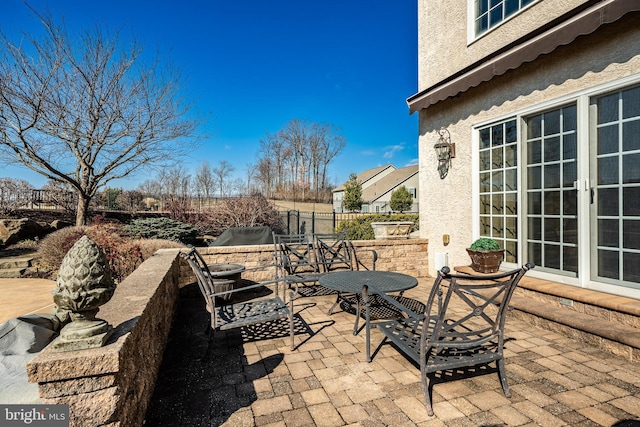 view of patio / terrace with outdoor dining space and fence