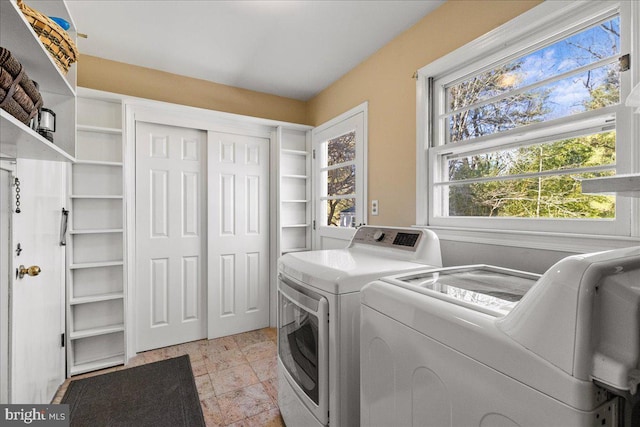 clothes washing area with laundry area and independent washer and dryer