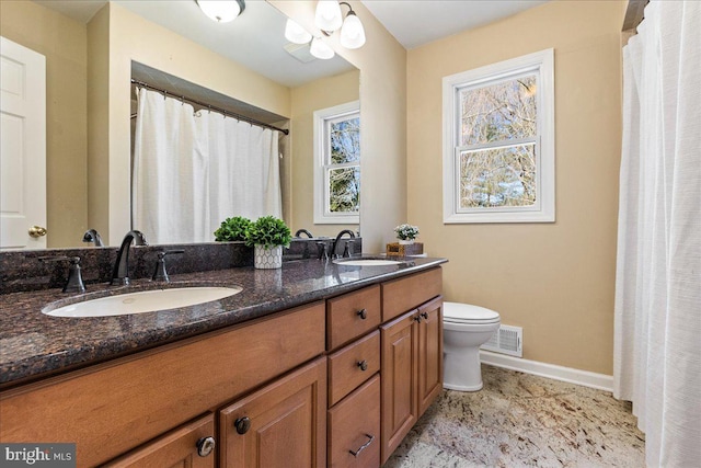 full bath with toilet, visible vents, a sink, and baseboards